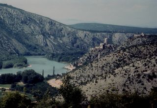 Lower Neretva Valley - pictured from behind the walls of Počitelj, looking north and upstream towards Počitelj village and its Citadel, and further behind Mostar
