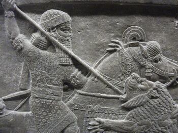 Assyrian relief; King Ashurbanipal spears a lion