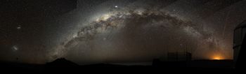 Part of the Milky Way arch emerging from the Cerro Paranal on the left, and sinking into the Antofagasta's night lights.