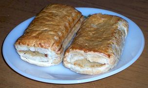 Two sausage rolls on a plate