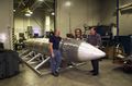 Al Weimorts (left), the creator of the GBU-43/B Massive Ordnance Air Blast bomb, and Joseph Fellenz, lead model maker, look over the prototype before it was painted and tested.