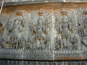 An art depiction of the Trimurti at the Hoysaleswara temple in Halebidu