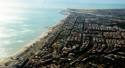 Aerial view of Ostia, with the Tiber and its mouth in the background