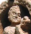 Detail of the face of a Kushan devotee.