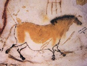 Painting of a dun horse on the wall of Lascaux Cave in France.