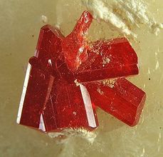 Realgar, gemmy crystals on calcite, 8.9 x 6.9 x 3.6 cm. From Shimen County, Hunan Province, China
