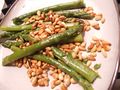 Steamed asparagus prepared with roasted pine nuts