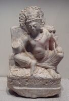 Seated Avalokiteshvara, white marble, Khair Khaneh, 6th-7th century CE. Musée Guimet MA 8151.[127]