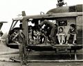 RVNAF Huey full with evacuees on the deck of USS Midway