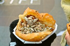 Hotteok (a variety of filled Korean pancake) with edible seeds, sugar, and cinnamon