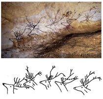 A painting on a cave wall of a number of deer stags, one of which appears to have moons between its horns, and a line drawing of the same images