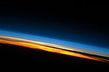 Limb view, of Earth's atmosphere. Colors roughly denote the layers of the atmosphere.