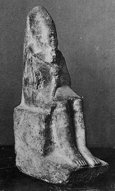 Statuette of a seated king holding a mace and wearing the long crown of Upper Egypt