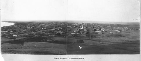 A 19th-century panorama view looking into the city of Kokshetau before rebuilding as seen from the Bukpa Hill Lookout. The Lake Kopa is visible to the left, and the St George's Church to the right.
