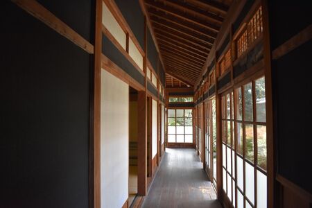 Engawa lined with paper-coated shoji (left, frame on inside) and surrounded by all-glass garasu-do (right). The lower glass is frosted.