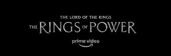 The series' title, "The Lord of the Rings: The Rings of Power", in silver metal letters on a black background.