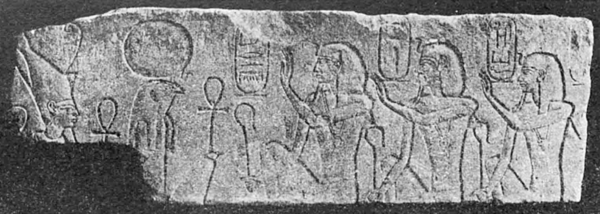 Relief showing three kings looking right, with hieroglyphs around their heads