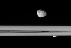 Janus and Prometheus lie above and below Saturn's rings (2006-04-29).