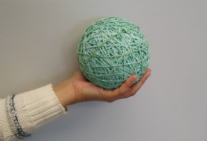 A rubber band ball made from over 3,000 individual rubber bands.
