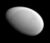 A smooth, featureless ellipsoidal object illuminated from the top right, distinctly looking like an egg.