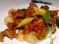 Sweet and sour pork, a Chinese dish that is popular in Europe and Americas.