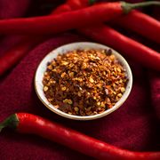 Dried chili pepper flakes and fresh chilies