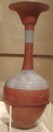A long-necked bottle with a decorative floral pattern from KV54, on display at the Metropolitan Museum of Art in New York City.