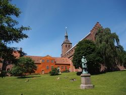 Odense Cathedral and the Hans Christian Andersen statue