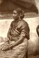 Woman in Tamil sari; in this style, the loose end is wrapped around the waist.