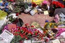 Recording artist Michael Jackson's Star, surrounded by flowers, candles, and cards, about two weeks after his death in 2009