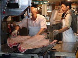 Photo of split tuna resting on cutting machine