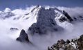 In mountainous areas one often finds the peaks above the clouds as seen here with the Piz Bernina in the Swiss Alps.