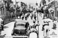 The fall of Damascus to the Allies, late June 1941. A car carrying the Free French commanders, General Georges Catroux and Major-General Paul Louis Le Gentilhomme, enters the city. They are escorted by Vichy French Circassian cavalry (Gardes Tcherkess).