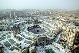 A photograph of Mecca in 2019, featuring Al-Masjid Al-Haram in the foreground, and Jabal an-Nour in the background. Jabal Abu Qubays is to east of the mosque, in the right hand side of the photograph.