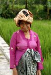 An elderly Sundanese woman wearing batik sarong and headdress