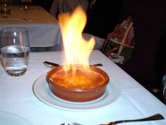 Preparation of crème brûlée, a rich custard base topped with a contrasting layer of hard caramel