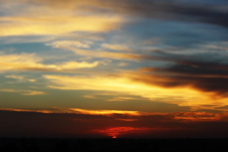 ملف:Sunset with orange clouds.JPG