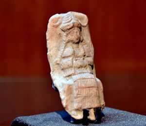 Mesopotamian female deity seating on a chair, Old-Babylonian fired clay plaque from Ur, Iraq.jpg