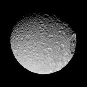 The side of Mimas that always points away from Saturn, imaged by Cassini on November 19, 2016 at a distance of 85,000 kilometers (53,000 miles).[40]