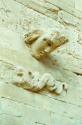Protruded head on a wall