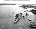 USS Oklahoma being rightened March 1943