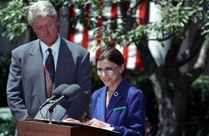 Ginsburg speaking at a lectern