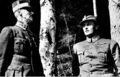Crown Prince Olav and his father King Haakon VII take shelter under birch trees as the German Luftwaffe bombs Molde