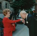 Denis Thatcher, husband of Margaret Thatcher, kissing the hand of Nancy Reagan wife of US President in 1988
