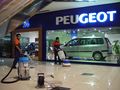 Globalisation: Peugeot in Jakarta, Indonesia. International trade coincides with the expansion of multinational corporations.