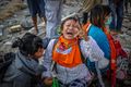 A woman mourns in Palu on Tuesday, October 2, after her relatives were found to have died in the earthquake.jpg