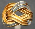 Gold finger ring in the shape of a reef knot