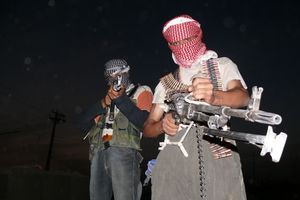 Iraqi insurgents with guns.JPG