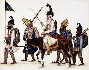 5 early Akali Sikh warriors, one carrying a flag, one on horseback.