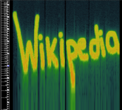 The word "Wikipedia" in yellow over a dark blue/black background